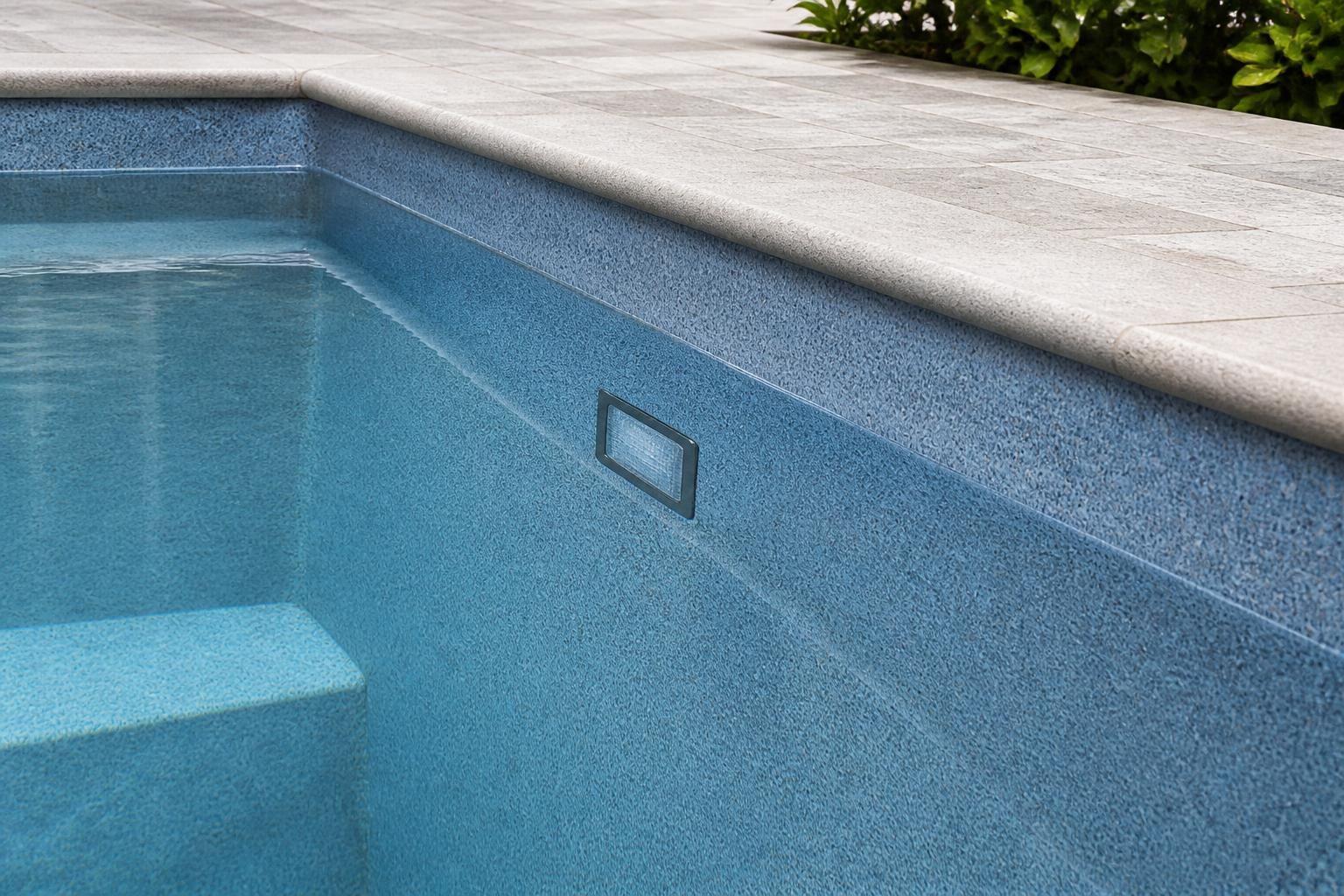 A freshly resurfaced pool interior with a smooth new finish.